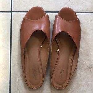 Used faux leather slides
